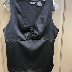 Black, sleeveless top with sequin detail.